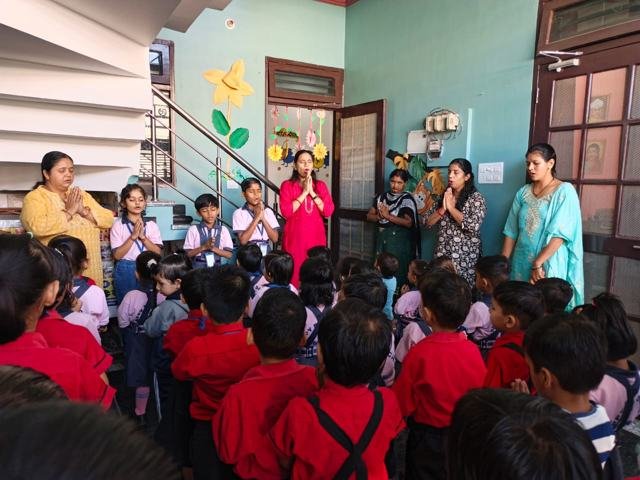 Assembly: Teachers and children together
